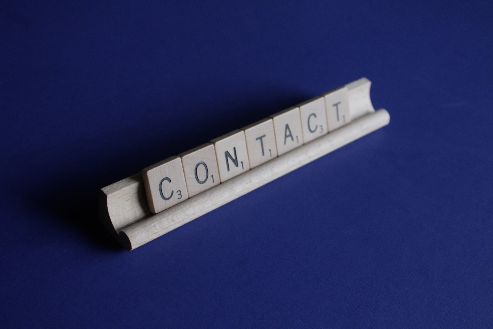 Contact made of letters from Scrabble game