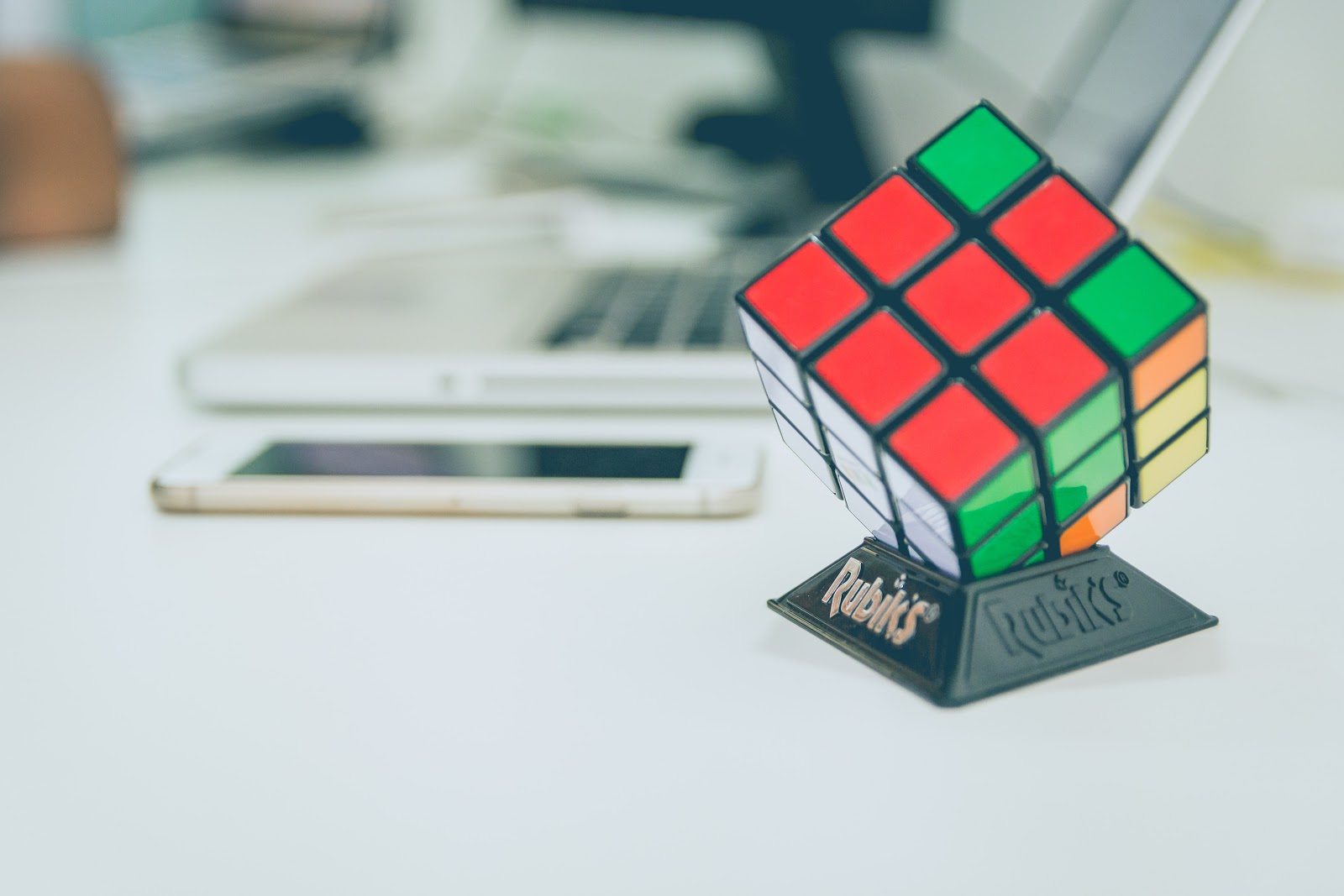 Rubik's Cube near the laptop