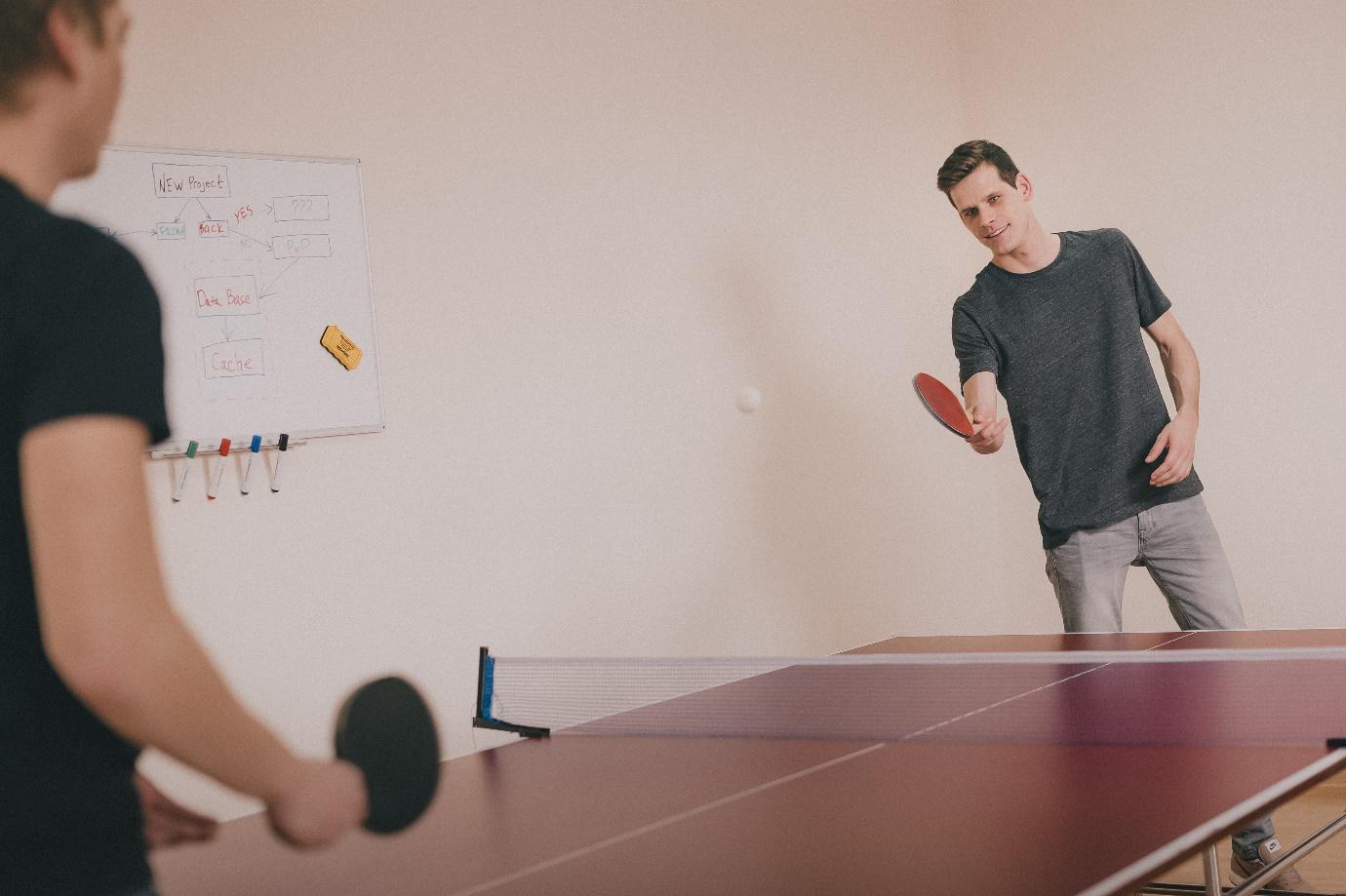 Two people playing ping-pong