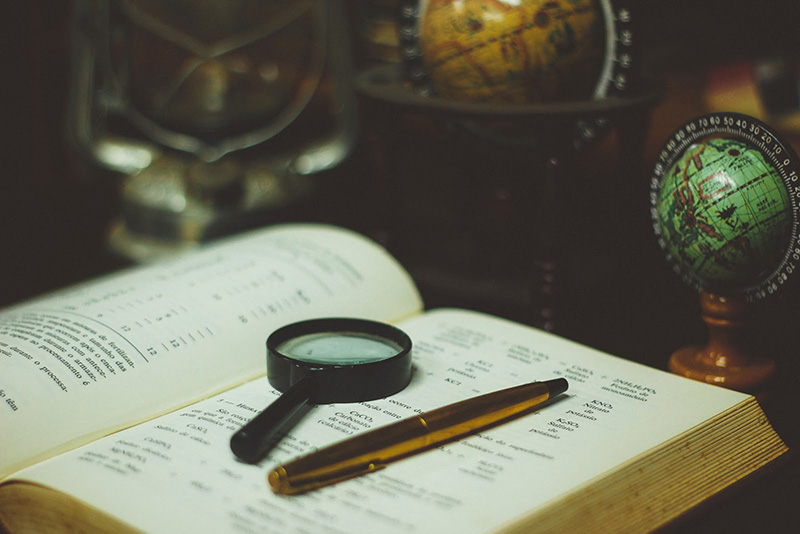 Magnifying glass on the book