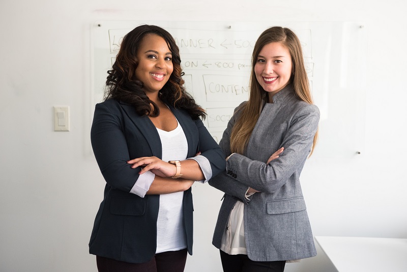 Two women after a successful business presentation