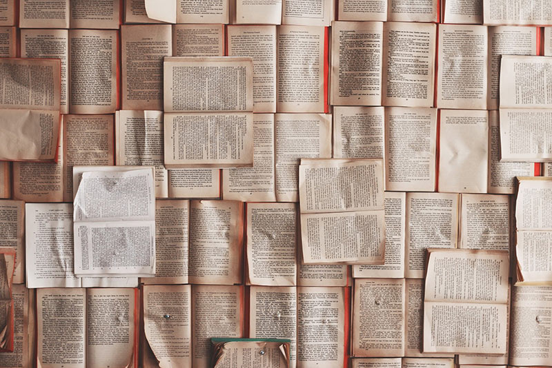 Opened books nailed to the wall