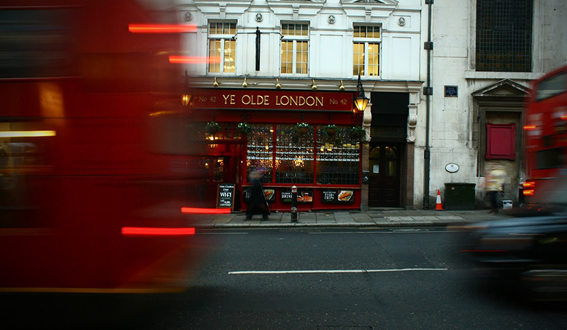 Blured busses rushing through the street