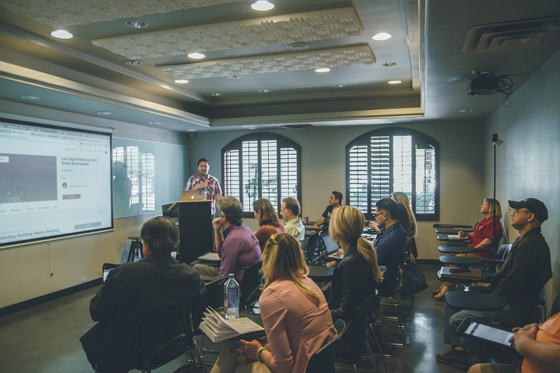 a studying class with teacher presenting a new topic