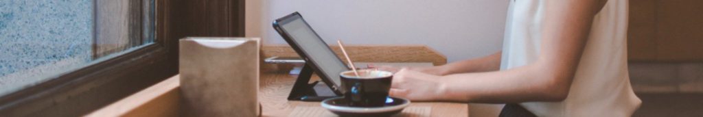 Designer's working process with a tablet and a coffee