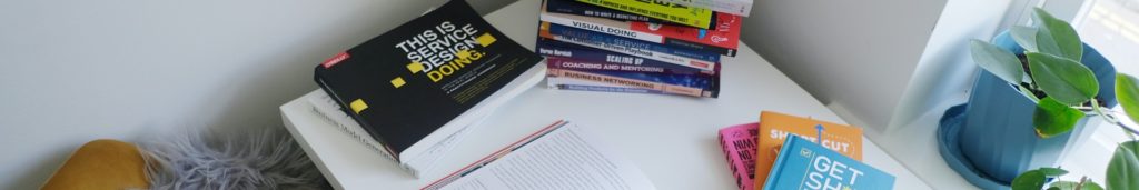 A desk with many books on it