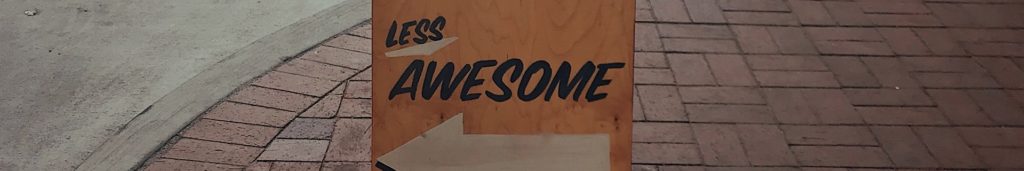 Sign with the text "Less Awesome" on it