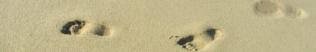 Imprints of a child's foot on the sand