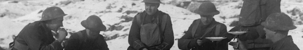 WWI soldiers eating outside